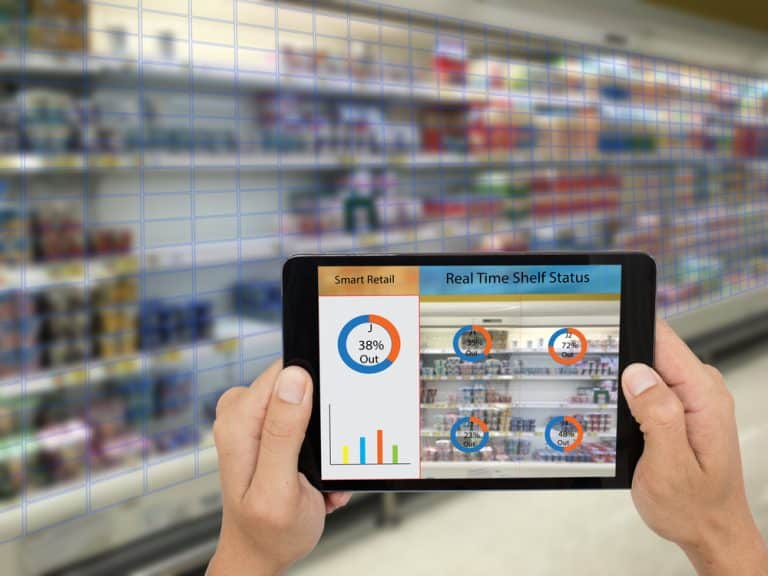 image of someone walking around a supermarket with an ipad showing tracking data