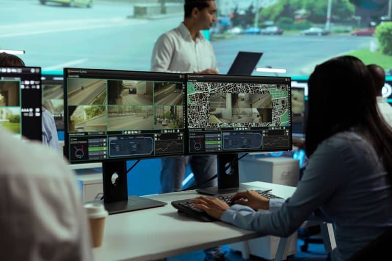 woman watching cctv surveillance feed