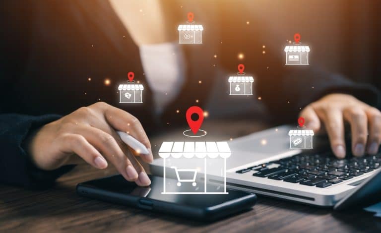 image of showing a woman with laptop managing multiple online stores